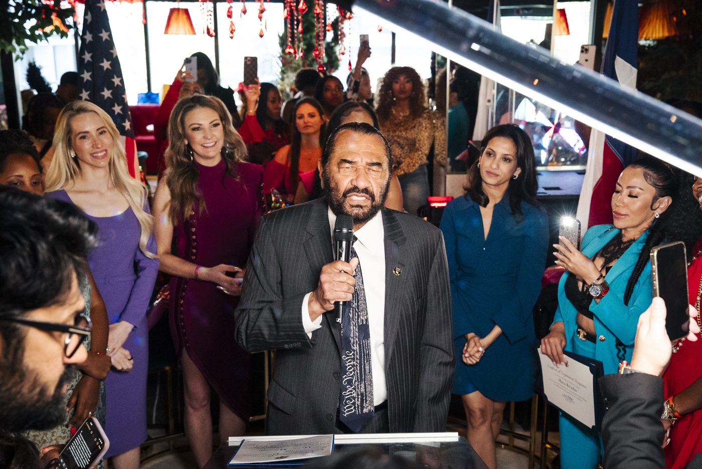 Congressman speaking at a Houston event — speaker and
podium photography