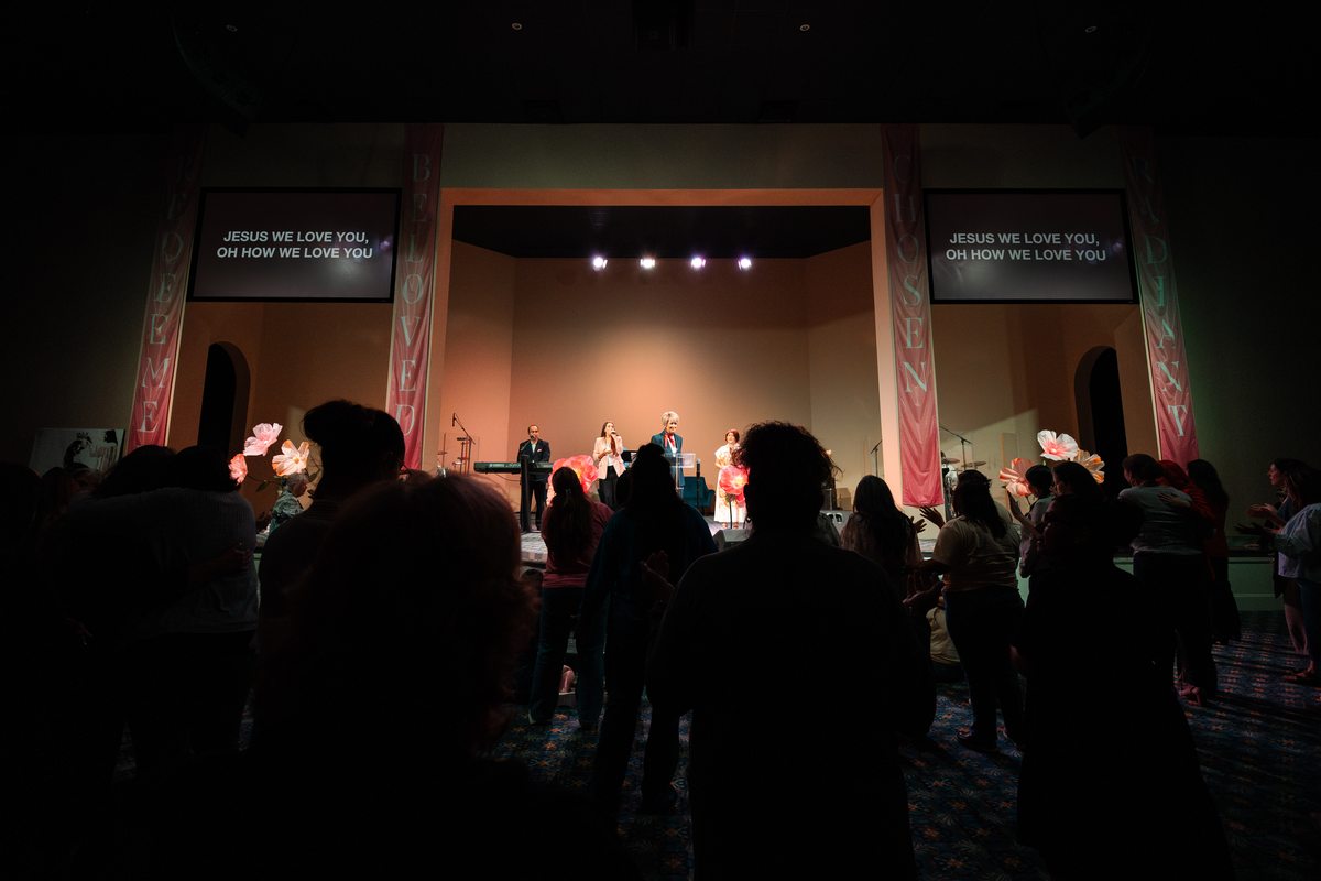 Pastor leading worship at a church event