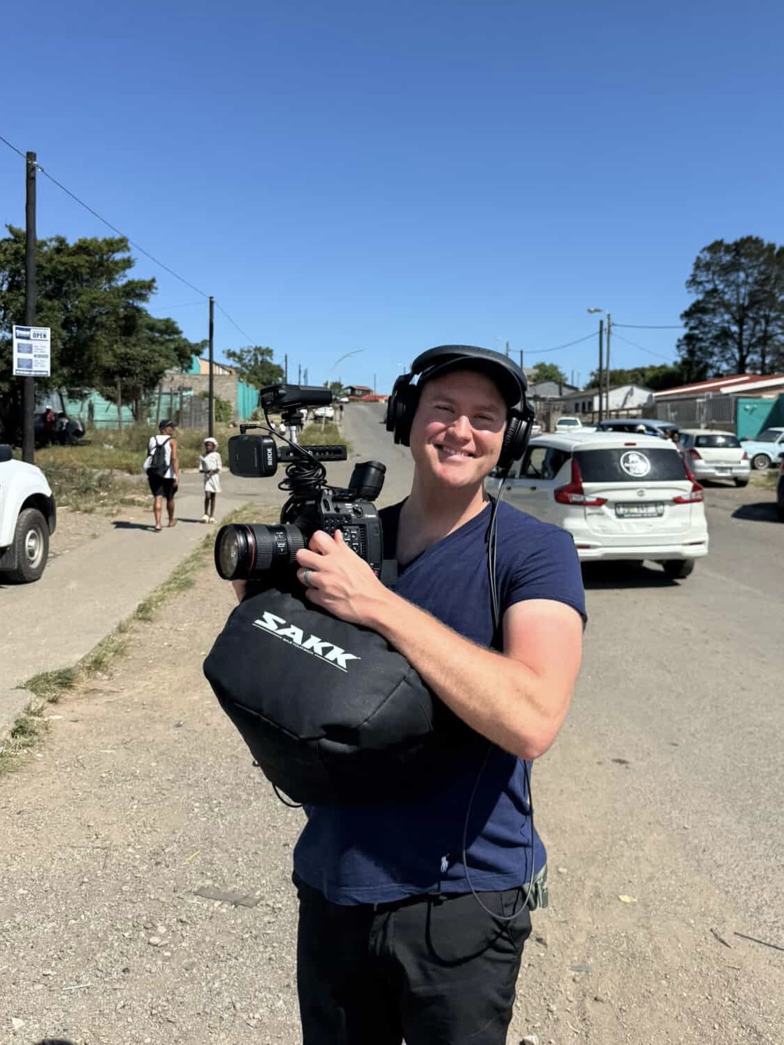 Travis Phillips filming documentary work in the streets
of South Africa
